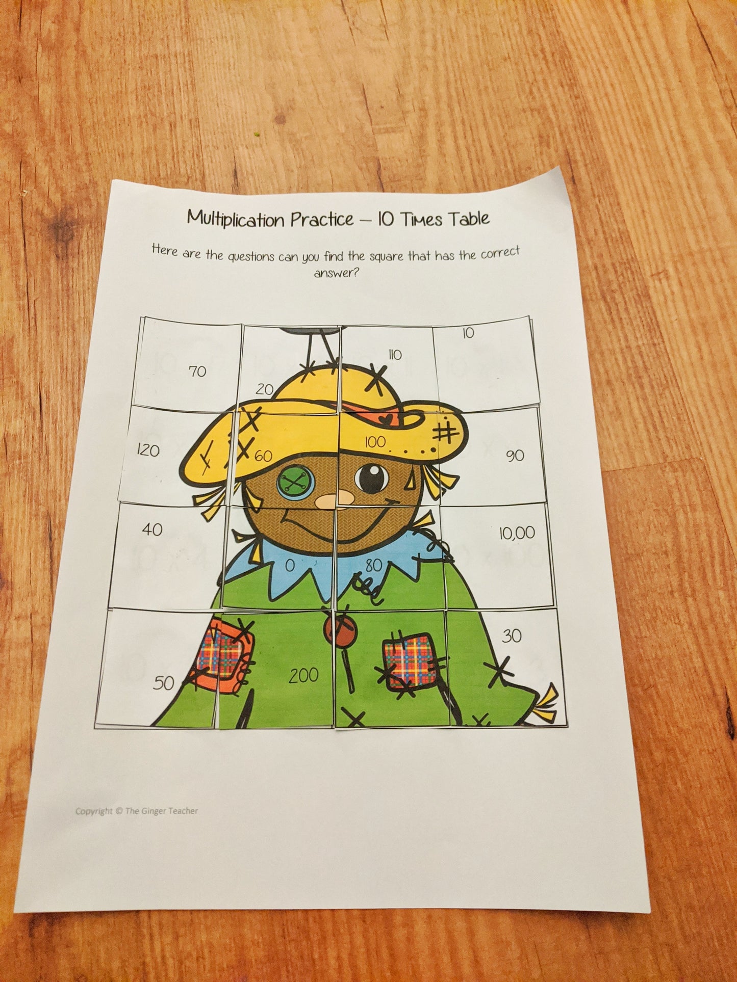 Fall Themed Independent Multiplication Revision Sheets 10x No Prep independent revision activity for the ten times tables. Children have to cut out and stick the correct answer to the question square, when the correct squares are all in place a fall themed picture will be revealed. #teachmultiplication #revisemultiplication #tentimestables #noprep #mathsworksheets