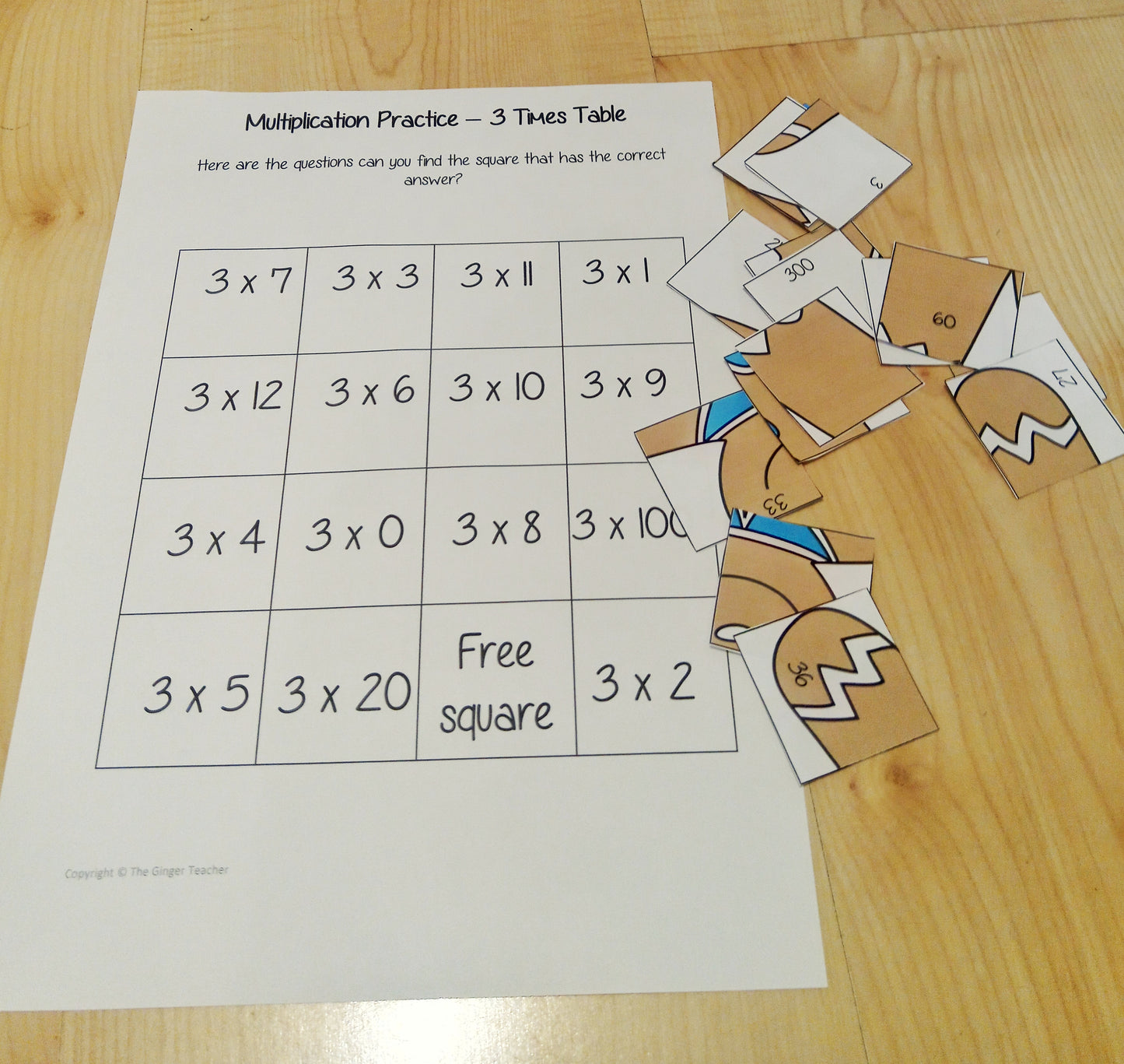 Christmas Themed Independent Multiplication Revision Sheets 3x No Prep independent revision activity for the three times tables. Children have to cut out and stick the correct answer to the question square, when the correct squares are all in place a christmas themed picture will be revealed. #teachmultiplication #revisemultiplication #threetimestables #noprep #mathsworksheets