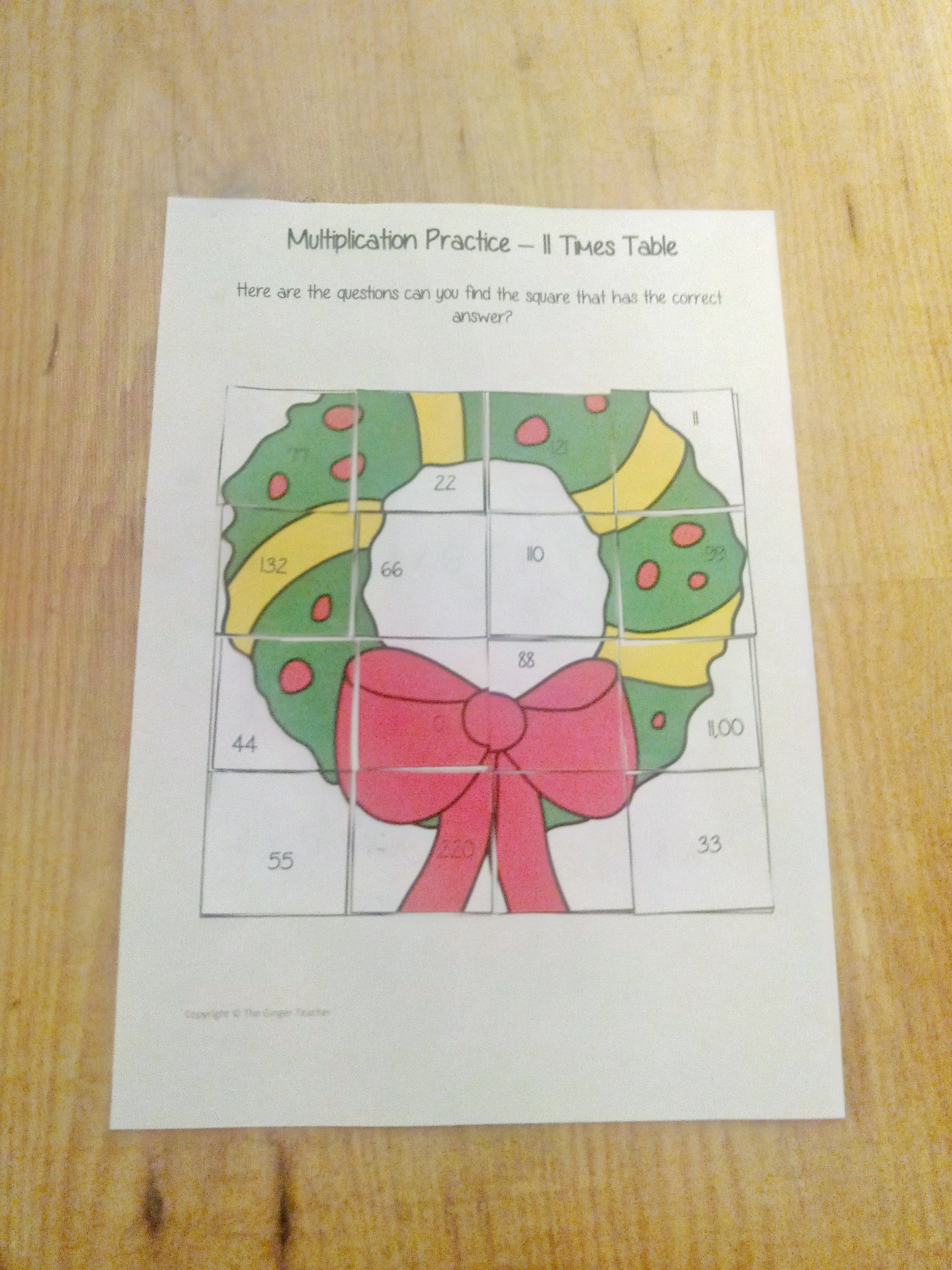 Christmas Themed Independent Multiplication Revision Sheets 11x No Prep independent revision activity for the eleven times tables. Children have to cut out and stick the correct answer to the question square, when the correct squares are all in place a christmas themed picture will be revealed. #teachmultiplication #revisemultiplication #eleventimestables #noprep #mathsworksheets